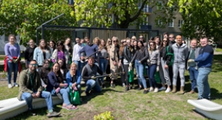 Colleagues from office in Lodz, Poland, gather after volunteering project in Anstadt Square