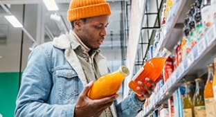 Man choosing low sugar juice drink