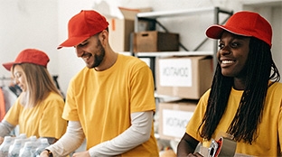 People volunteering at food bank to support local communities